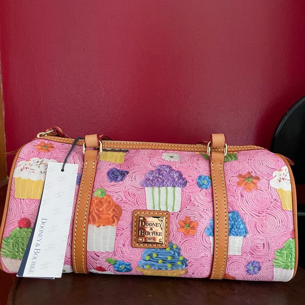 Dooney & Bourke Pink cupcake barrel bag